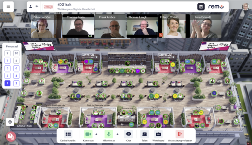 Screenshot aus der Netzwerkumgebung "Remo" mit vielen virtuellen Tischen, an denen sich Menschen zu kleineren Videokonferenzgruppen treffen können.